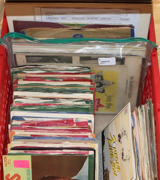 A collection of 78, 45 and 33 vinyl records, mainly Elvis Presley